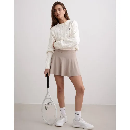 Damski skort wysoki stan, wbudowane szorty, odprowadzający wilgoć Sense beżowy